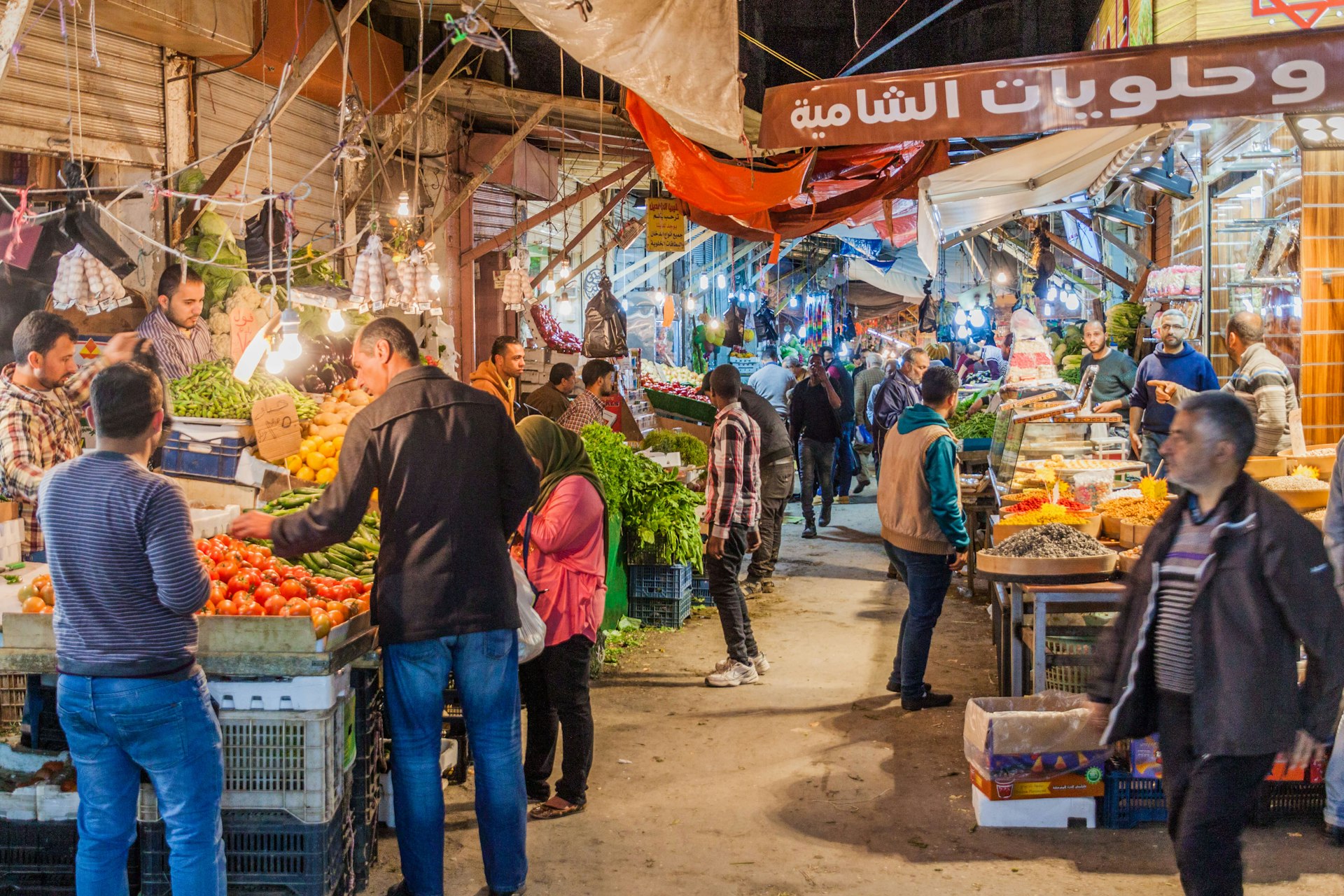 People shopping at a fruit and vegetable market in Amman, Jordan